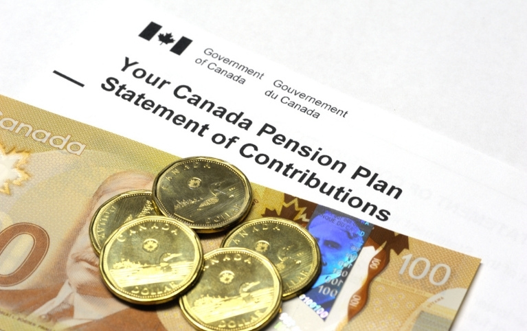 Your Canadian Pension Plan Statement of Contributions with a 100 dollar bill and some dollar coins